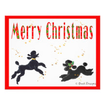 Caniches noirs jouant l'invitation de Joyeux Noël