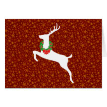 Cerfs communs blancs de rêne avec la guirlande de  carte de vœux