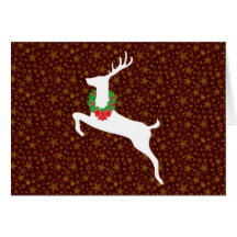 Cerfs communs blancs de rêne avec la guirlande de  carte de vœux