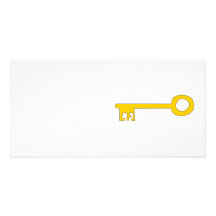 Clé d'or sur le blanc photocartes