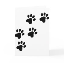 schwarzes niedliches Hundetatzenhündchen