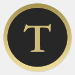 T:: Elegantes Gold des Monogramm-T und schwarzer A