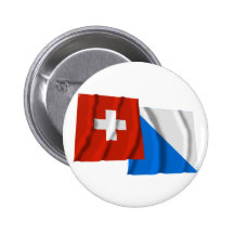 Wellenartig bewegende Flaggen der Schweiz u. Züric Buttons