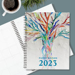 2023 Personalisiert Planer<br><div class="desc">Dieser einzigartige Planner ist mit einem blassgrauen Mosaikbaum in lebhaften Farben dekoriert. Passen Sie es mit Ihrem Namen und Jahr an. Verwenden Sie zum Bearbeiten das Entwurfstool, um den Schriftart, die Größe des Schriftartes oder die Farbe zu ändern. Weil wir unsere Kunstwerke erstellen, werden Sie dieses exakte Bild von anderen...</div>