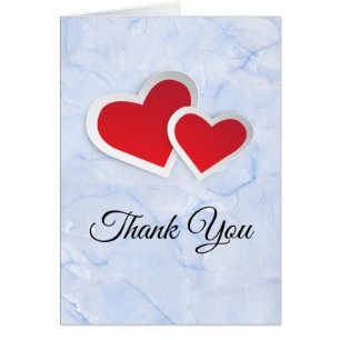 2 Coeurs en papier rouge sur Merci en marbre bleu