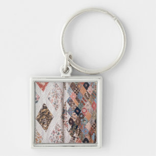 53: Detail einer Patchworksteppdecke hergestellt Schlüsselanhänger