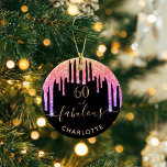 60 Fabulous birthday black rainbow glitter sparkle Keramik Ornament<br><div class="desc">Trendy and glamorous for 60th birthday. A classic black background decorated with rainbow colored faux glitter drips, paint dripping look in purple, pink and rose gold. With the text: 60 and fabulous. Personalize and add a name and age. Golden colored text. The word Fabulous is written with a modern hand...</div>