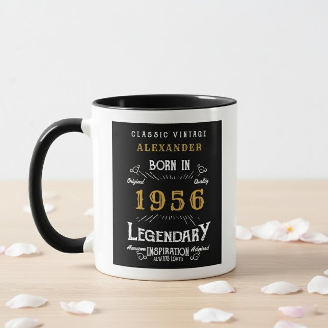 70th Birthday 1956 Legend Retro Black Personalized Tasse (Born 1956 birthday gift mug. White wall background, wood table with petals.)