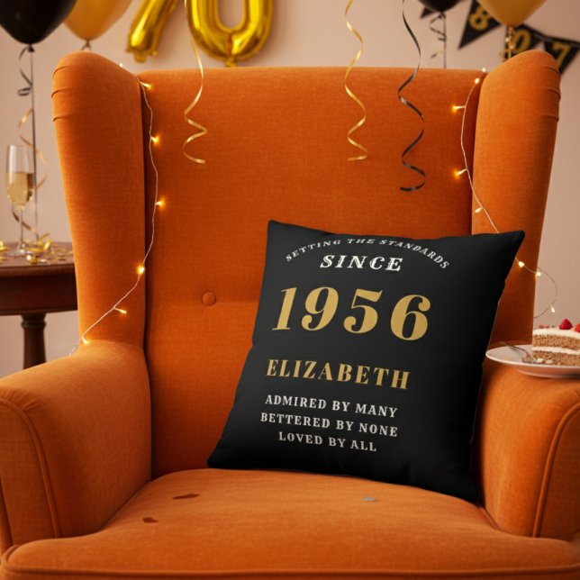 70th Birthday Gift Personalized 1956 Black Gold Kissen (Personalized 70th birthday throw pillow on an orange velvet wingback chair)