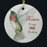 70th Birthday Hummingbird Keepsake Watercolor Keramik Ornament<br><div class="desc">Delight a special woman on her 70th birthday with a ruby-throated hummingbird ceramic ornament. Write her name in a lovely burgundy script to personalize the elegant design. The watercolor painting of the hummingbird was created with rich colors of green, ruby and cream. A chic and stylish keepsake for a woman...</div>
