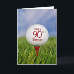 90th Birthday Golf Ball Karte<br><div class="desc">Close up of a white golf ball on a red tee in grass with sky background for 90th birthday.</div>