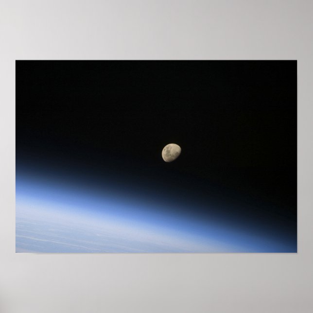 A gibbous moon visible above Earth's atmosphere Poster (Vorne)