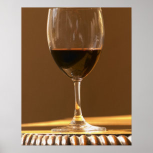 A glass of red Chateau Belgrave in sunlight - Poster