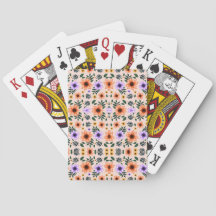 A hand holds a fan of playing cards