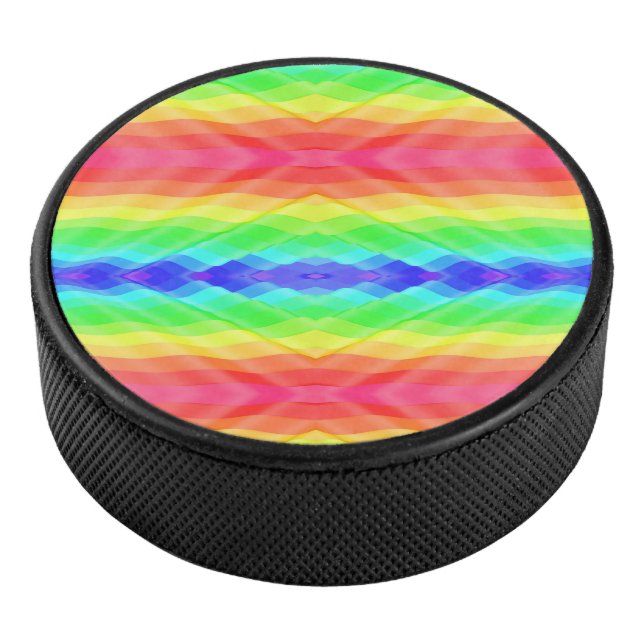 A hockey puck with a vibrant, symmetrical rainbow  (3/4)
