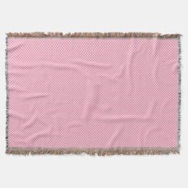 A pink woven blanket with a subtle pattern  decke