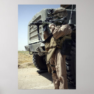A soldier provides security for Marines Poster