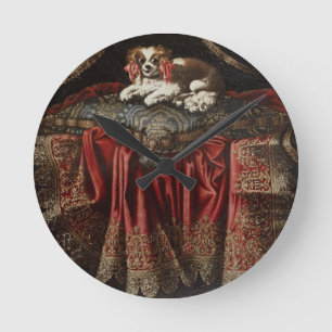 A spaniel seated on an embroidered cushion runde wanduhr