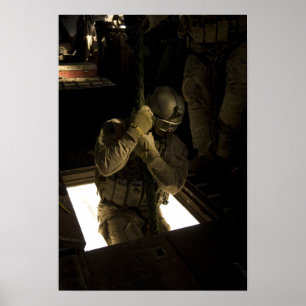 A US Air Force pararescueman begins his descent Poster