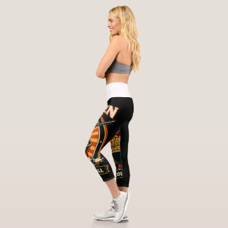 A women’s light blue denim jacket featuring a bold capri leggings