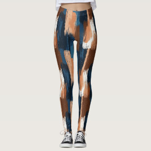 Abstrakte Pinselstriche in Blau, Weiß und Braun Leggings