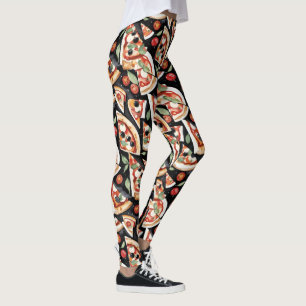 Abstrakte Pizzaslics auf schwarzem Hintergrund Leggings