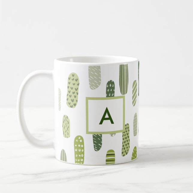 Abstraktes Monogramm aus grüner Pastete Kaffeetasse (Links)