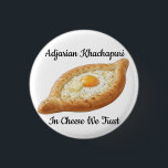 Adjarian Khachapuri  Button<br><div class="desc">Adjarian Khachapuri is a traditional Georgian dish from the region of Adjara, located along the Black Sea coast of Georgia. It is a boat-shaped bread made from soft yeast dough, filled with melted cheese, and topped with a fresh egg yolk and a slice of butter. Before eating, the egg and...</div>