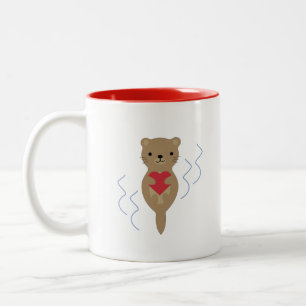 Adorable Otter umarmt ein Herz Zweifarbige Tasse