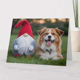 Adorable Plush Gnome and Fluffy Dog Lying in Grass Karte