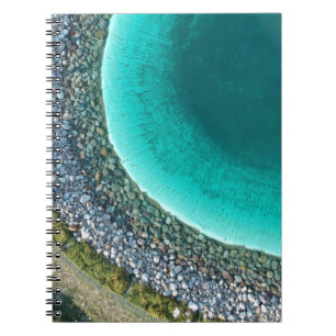 Aerial photography of body of water surrounded wit notizblock