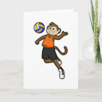 Affe als Volleyballspieler mit Volleyball