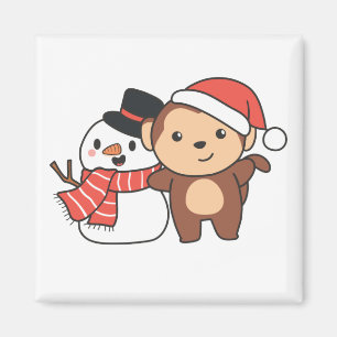 Affe mit Schneemann im Winter für Weihnachtsmagazi Magnet