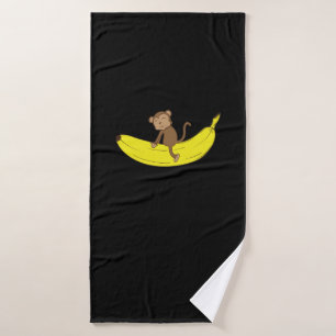 Affe reitet auf Banane Badehandtuch