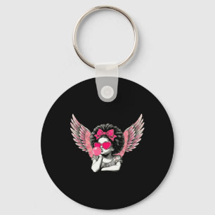 Afro Cupid mit Sonnenbrille beim Aufblasen von Bub Schlüsselanhänger