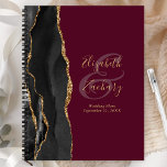 Agate Geode Script Black Gold Burgundy Wedding Planer<br><div class="desc">Dieser moderne Hochzeitsplaner besticht durch ein schwarzes Aquarell-Design, das mit Imitaten mit goldenem Glitzer bestickt wurde. Anpassen Sie den goldfarbenen Text auf bordeauxfarbenem Hintergrund, mit den Namen der Braut und des Bräutigams in handschriftlicher Kalligraphie über einen großen Ampersand. Fügen Sie den Titel und das Hochzeitdatum unten in Kursivschrift hinzu. Die...</div>