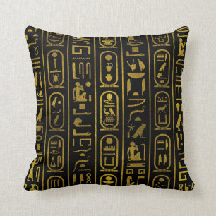 Ägyptische alte Goldhieroglyphen auf Schwarzem Kissen