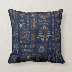 Ägyptische Hieroglyphen und Gottheitgold auf Kissen