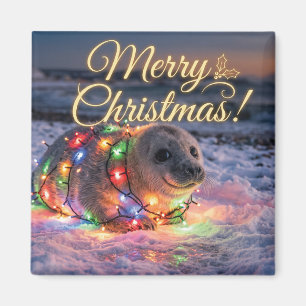 Aimant Bébé phoque mignon enveloppé de guirlandes de Noël