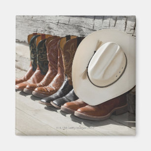 Aimant Casquette de cowboy sur la rangée des bottes de