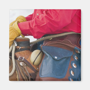 Aimant Cowboy sur les gerçures de port de cuir de cheval