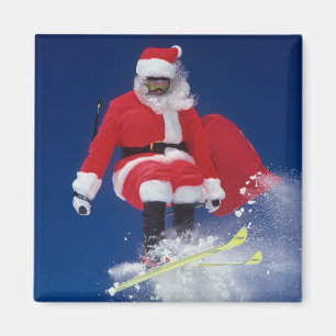 Aimant Le père noël sur sauter de skis outre d'une