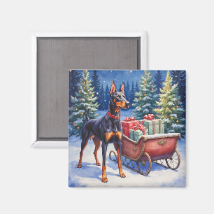 Aimant Noble Doberman gardant le traîneau de Noël en hive