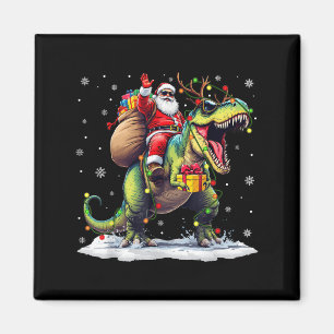 Aimant Père Noël à cheval sur un dinosaure T Rex Noël Gar