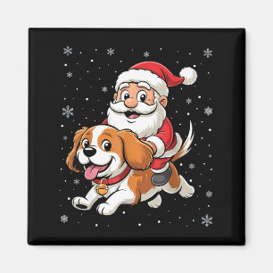 Aimant Père Noël montant un Cavalier King Charles Spaniel