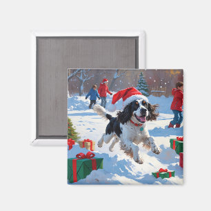 Aimant Springer Spaniel courant dans la neige avec un cha