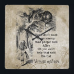 Alice im Wunderland; Cheshire-Katze mit Alice Quadratische Wanduhr<br><div class="desc">Alice im Wunderland; Cheshire-Katze mit Alice-Zuhause-Büro-Dekor-Wand-Uhr. Feenhafte Geschichten der Vintagen Illustration und Kinderzimmerreimbild von Alice mit der Cheshire-Katze durch John Tenniel in Lewis Carroll Alices Abenteuern in Märchenland, 1865, ein Text-entworfener Dialog eingeschlossen. "Wir sind alle hier":) gesetzt auf einen alten Blumenpergamentpapierhintergrund wütend. (fertigen Sie besonders an, um diesen Gegenstand zu...</div>