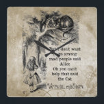 Alice im Wunderland; Cheshire-Katze mit Alice Quadratische Wanduhr<br><div class="desc">Alice im Wunderland; Cheshire-Katze mit Alice-Zuhause-Büro-Dekor-Wand-Uhr. Feenhafte Geschichten der Vintagen Illustration und Kinderzimmerreimbild von Alice mit der Cheshire-Katze durch John Tenniel in Lewis Carroll Alices Abenteuern in Märchenland, 1865, ein Text-entworfener Dialog eingeschlossen. "Wir sind alle hier":) gesetzt auf einen alten Blumenpergamentpapierhintergrund wütend. (fertigen Sie besonders an, um diesen Gegenstand zu...</div>