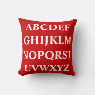 ALPHABET BLANC sur coussin rouge