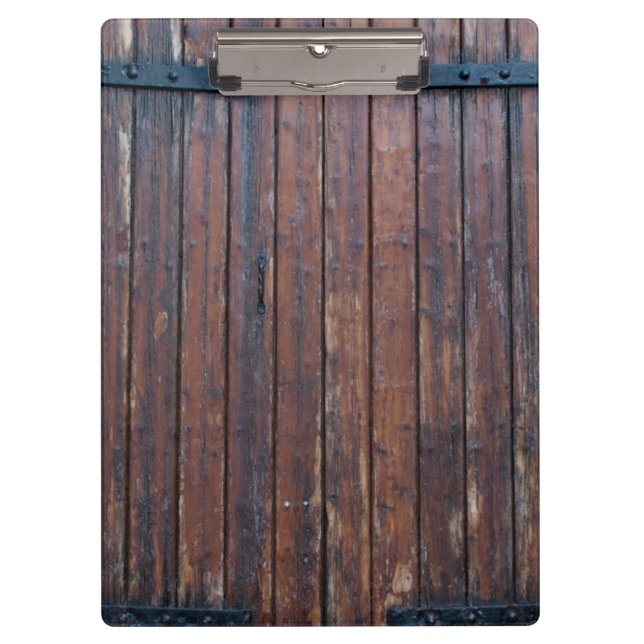 Alte braune Holztüren mit schwarzem Eisen unterstü Klemmbrett (Vorderseite)